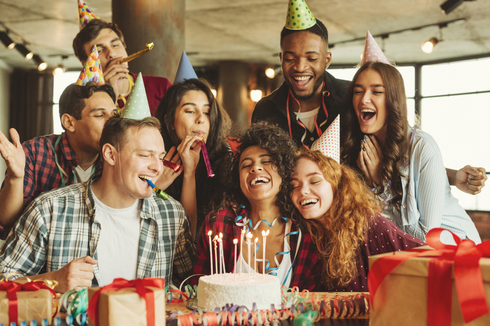 Happy friends at birthday party. Happy birthday to you concept