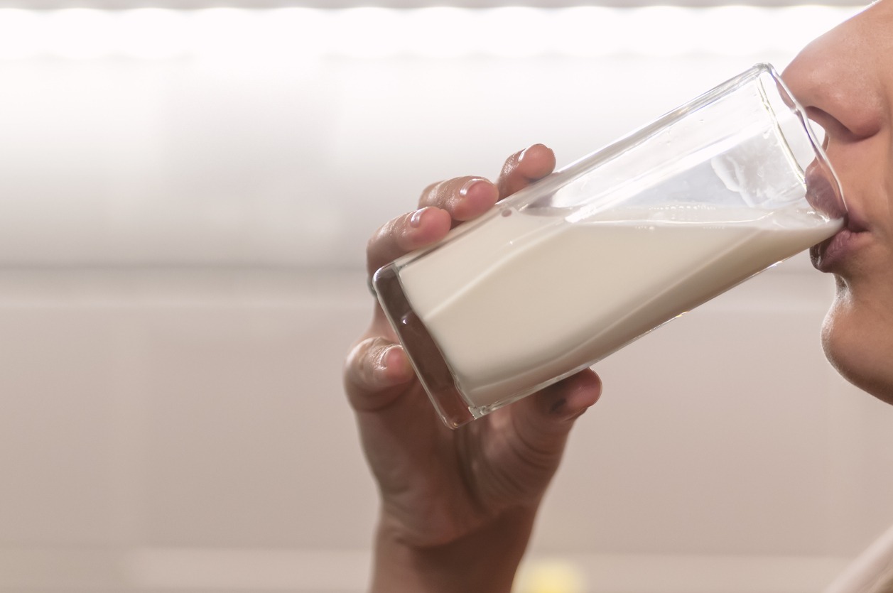Woman-drinking-from-a-glass-of-soya-milk