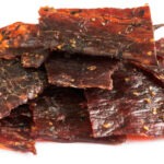 Beef jerky isolated on a white studio background
