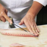 Red sea bream sashimi, Fresh Madai fish sliced by Japanese chef.